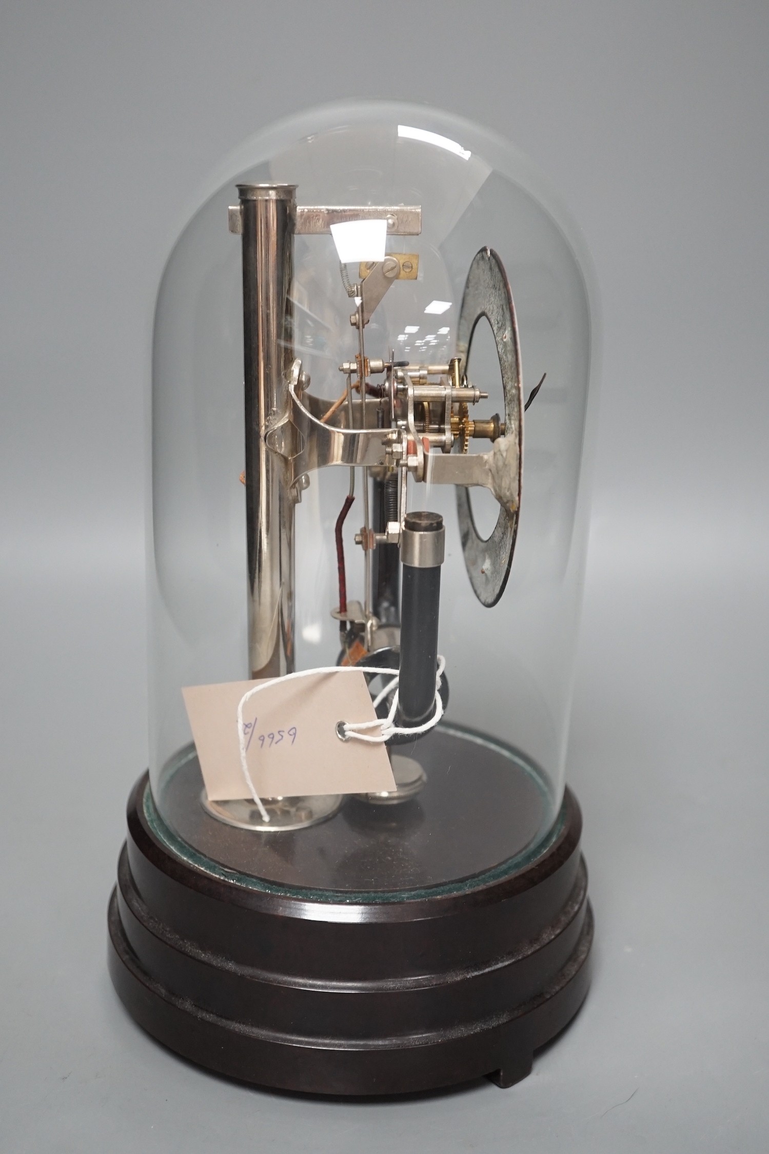 A 1930's electric mantel clock under glass dome, 26cms high